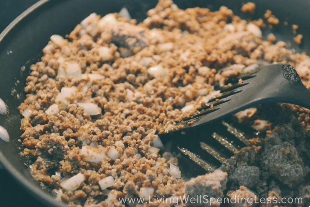Saute the crumbles and onion in a frying pan or nonstick skillet. Use a spatula to stir. 