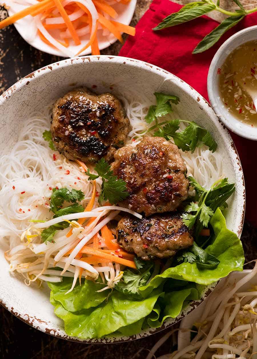 Overhead photo of Bun Cha - Vietnamese Meatballs in a bowl with noodles, ready to be eaten