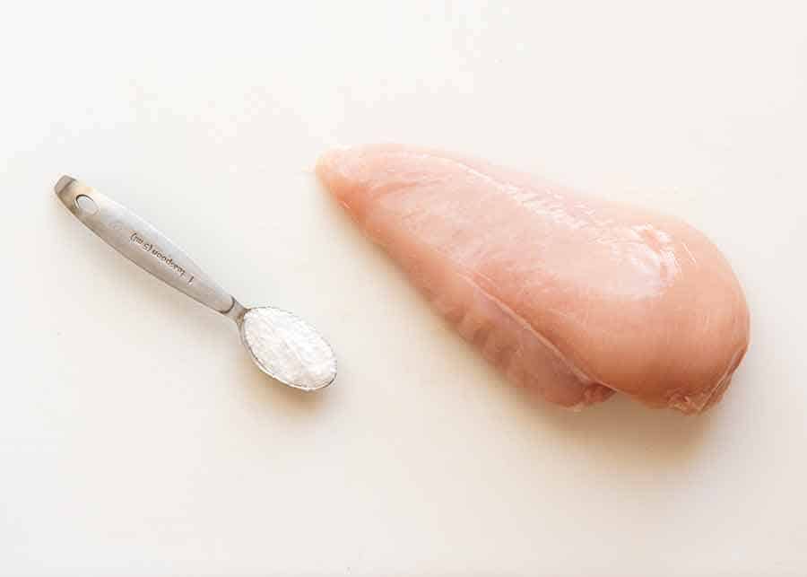 Photo of baking soda and raw chicken breast - to tenderise chicken